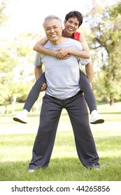 Senior Couple Working Out In Park