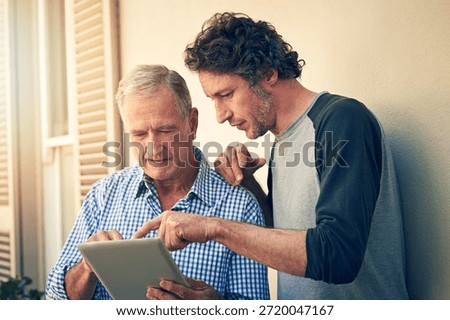 Senior dad, son and help with tablet for internet search, learning and bonding at home. Family, elderly father and mature man with digital tech for teaching, app guidance and how to for social media
