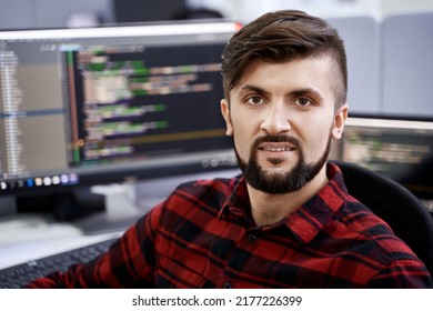 Senior Developer Working On Computer In IT Office, Sitting At Desk And Coding, Working On A Project In Software Development Company Or Technology Startup.