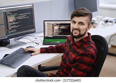 Senior Developer Working On Computer In IT Office, Sitting At Desk And Coding, Working On A Project In Software Development Company Or Technology Startup.