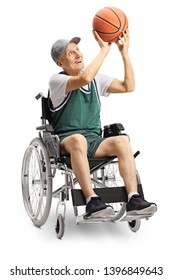 Senior Disabled Man In Wheelchair Shooting A Basketball Isolated On White Background
