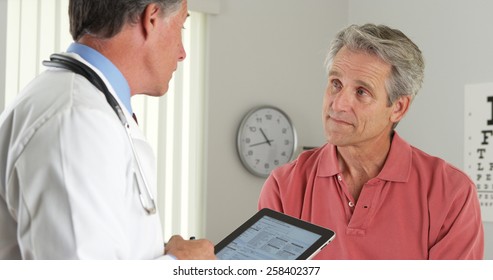 Senior Doctor Asking Elderly Patient Questions