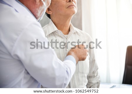 Senior Doctor is examining Asian patient with stethoscope in the hospital. Medical and health care concepts. Lung, Cancer, pneumonia. BeH3althy