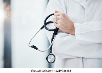 Senior Doctor, Hands And Stethoscope In Hospital Ready For Diagnosis, Check Up Or Heart Health Closeup. Healthcare, Expert Or Cardiologist Holding Equipment For Cardiology Exam In Doctors Office.