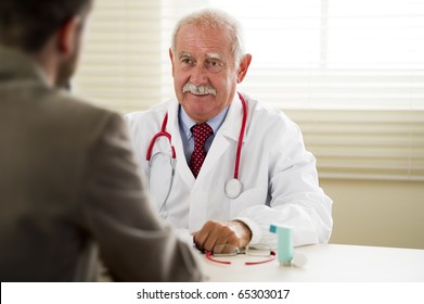 Senior Doctor With His Patient