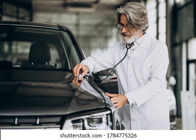 Senior Doctor Looking After A Car