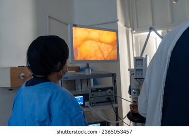senior doctor looking into the laparoscopic camera display where she understand the next move - Shutterstock ID 2365053457