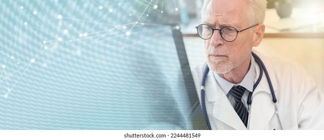 Senior doctor looking at x-ray in medical office; panoramic banner - Shutterstock ID 2244481549