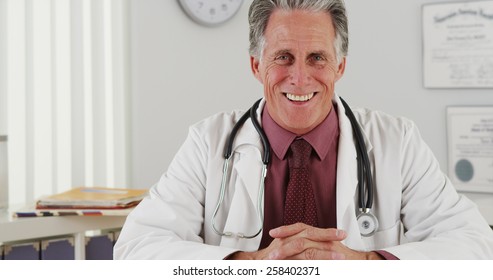 Senior Doctor Talking To Camera