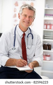 Senior Doctor Writing Prescription