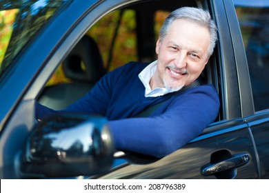 Senior Driving His Car