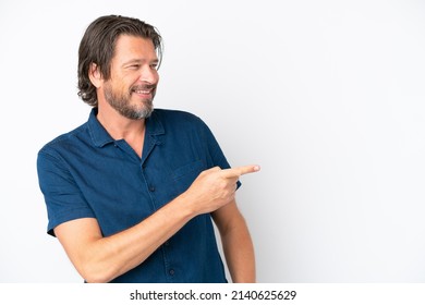 Senior dutch man isolated on white background pointing finger to the side and presenting a product