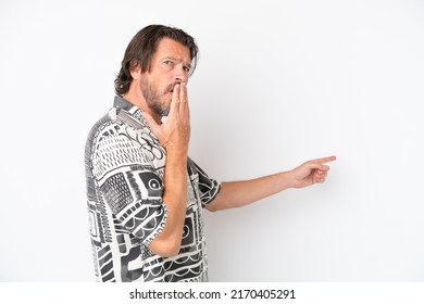 Senior dutch man isolated on white background with surprise expression while pointing side