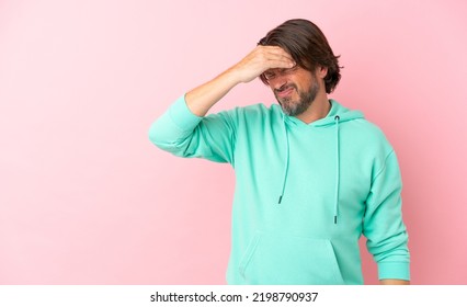 Senior Dutch Man Isolated On Pink Background With Headache