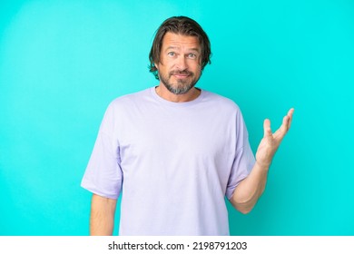 Senior Dutch Man Isolated On Blue Background Making Doubts Gesture