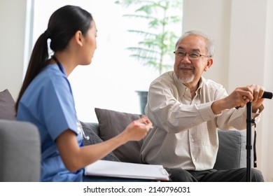 Senior elder man patient talking to caring female doctor physician at nursing home in hospital . Asain doctor explaining well-being get support and have medicare services at medical checkup visit. - Powered by Shutterstock