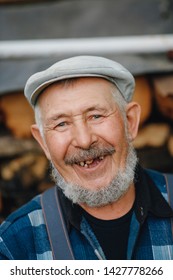 Senior Elderly Man With No Teeth And Caries Looks Smiles.