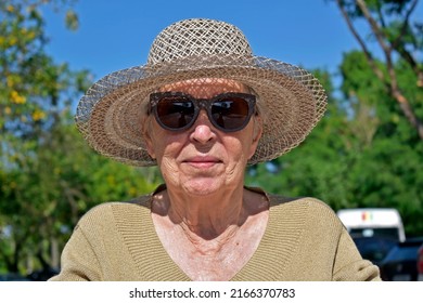Senior elderly woman smiling on the sunbathing