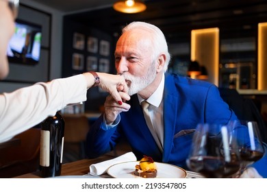 Senior Elegant Man Kissing Hand Of His Wife