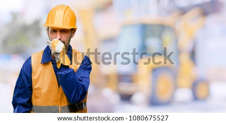 Senior engineer man, construction worker sick and coughing, suffering asthma or bronchitis, medicine concept at work