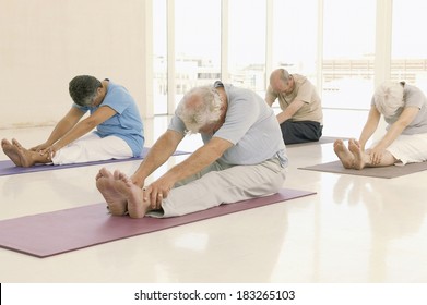 Senior Exercising At Gym