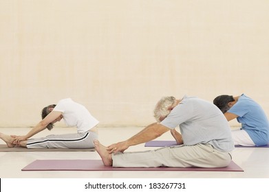 Senior Exercising At Gym