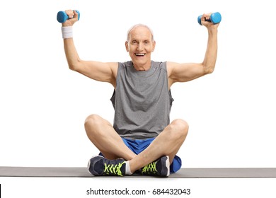 Senior Exercising With Small Dumbbells On An Exercise Mat Isolated On White Background