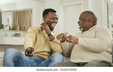 Senior father, son and remote on sofa with laughing for funny football match, esports or bonding in home. Happy family, black people and relax on couch with watching television, talking or sport show - Powered by Shutterstock