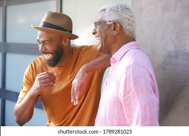 Senior Father Talking And Laughing With Adult Son In Garden At Home - Powered by Shutterstock