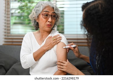 Senior Female Diabetes Taking Insulin From Nurse. Diabetes And Elderly Healthcare Concept