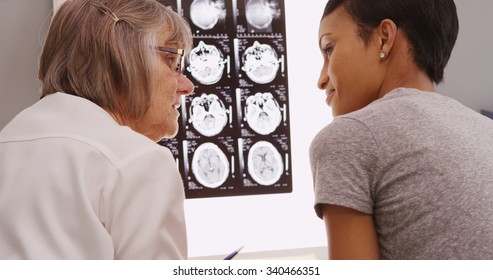 Senior Female Doctor Reviewing Xray Results With Patient