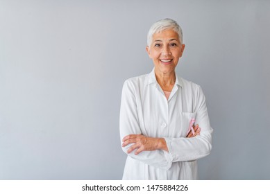 Senior Female Doctor. Woman Doctor Smiling And Looking To The Camera. Portrait Of Beautiful Mature Female Doctor Looking At Camera. Beautiful Female Doctor. Medical Concept 