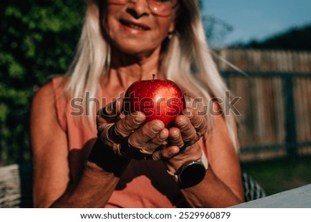 Similar – Foto Bild Äpfel von Hand vom Ast pflücken