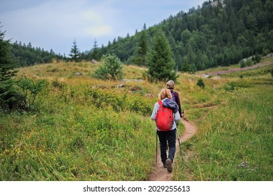 Senior Female Hiking Through The Valley