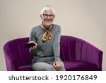 Senior female using tablet. Elderly lady having a video call during pandemic. Grey hair lady with a smart technology device. Senior people and new age technology. Grandma expressing emotions.