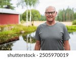 Senior Finnish Man Outdoors in a Scandinavian Forest Summer Portrait in the Woods