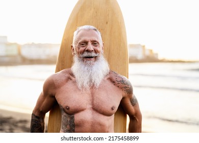 Senior Fit Man Having Fun Surfing On Tropical Beach - Elderly Healthy People Lifestyle And Extreme Sport Concept