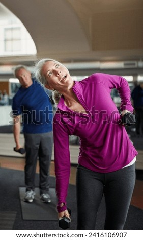 Senior fitness, dumbbells and people stretching at gym for training, wellness and cardio exercise. Class, workout and elderly men with old personal trainer for weightlifting, support or bodybuilding