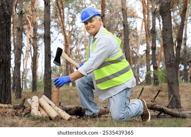 Senior forester with axe chopping wood in forest - Powered by Shutterstock