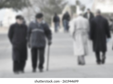 Senior Friends Walking In Park