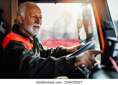 Senior Garbage Removal Worker Driving A Waste Truck.