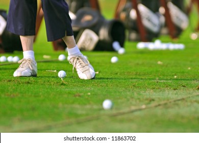 Senior Golfer Practices At The Driving Range