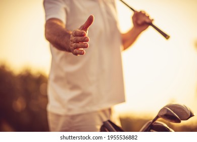 Senior golfer spreading his hand. Close up. Focus is on hand.  - Powered by Shutterstock