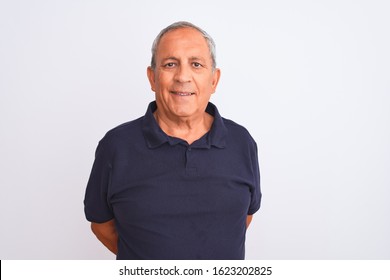 Senior Grey-haired Man Wearing Black Casual Polo Standing Over Isolated White Background With A Happy And Cool Smile On Face. Lucky Person.