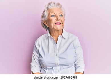 Senior Grey-haired Woman Wearing Casual Clothes Looking To Side, Relax Profile Pose With Natural Face And Confident Smile. 