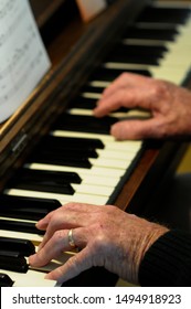Senior Hands On Piano Keys