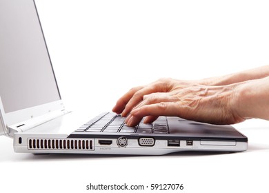 Senior Hands Typing On The Computer Keyboard