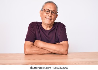 Senior Handsome Man With Gray Hair Wearing Casual Clothes And Glasses Happy Face Smiling With Crossed Arms Looking At The Camera. Positive Person. 