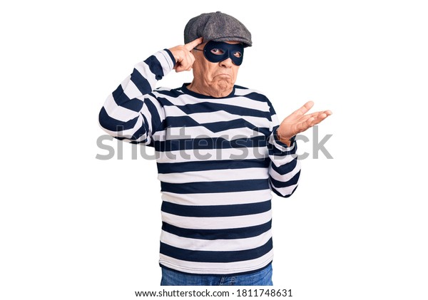 senior-handsome-man-wearing-burglar-600w-1811748631.jpg