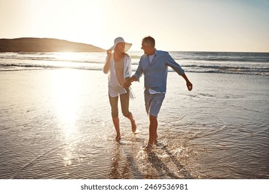 Senior, happy couple and playing with beach sunset for love, embrace or bonding together in nature. Man, woman or lovers enjoying outdoor fun or summer holiday by water or ocean coast in sunshine - Powered by Shutterstock